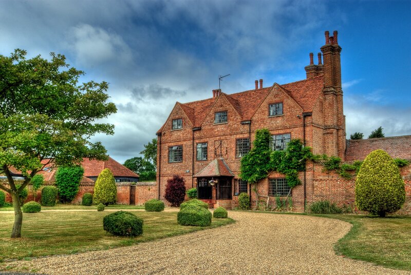 Brick house with gravel driveway