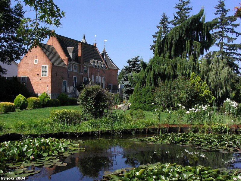 Brick house with pond and garden