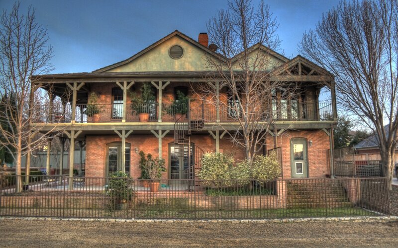 Brick house with porch and spiral staircase