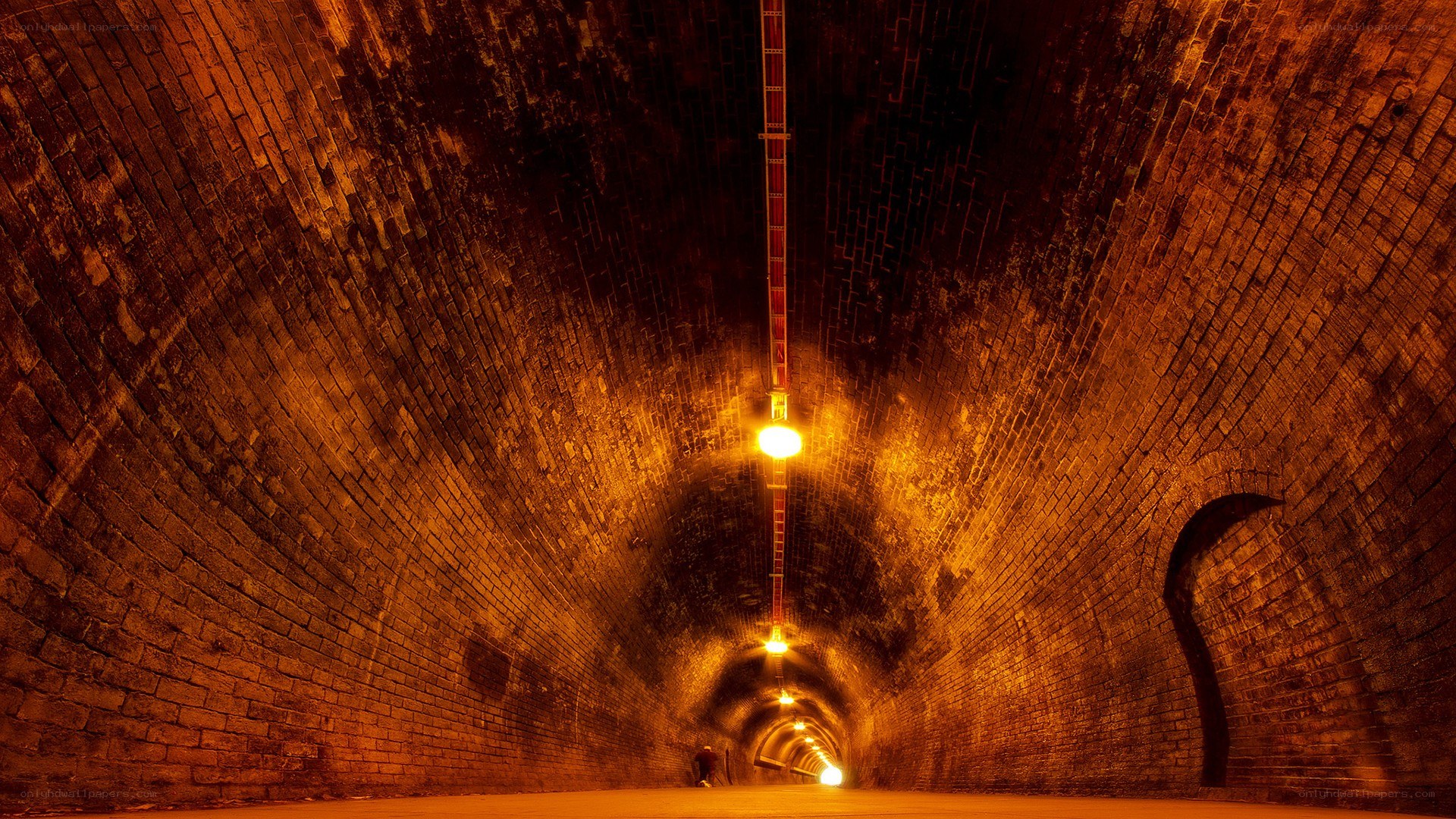 Brick tunnel with warm lighting