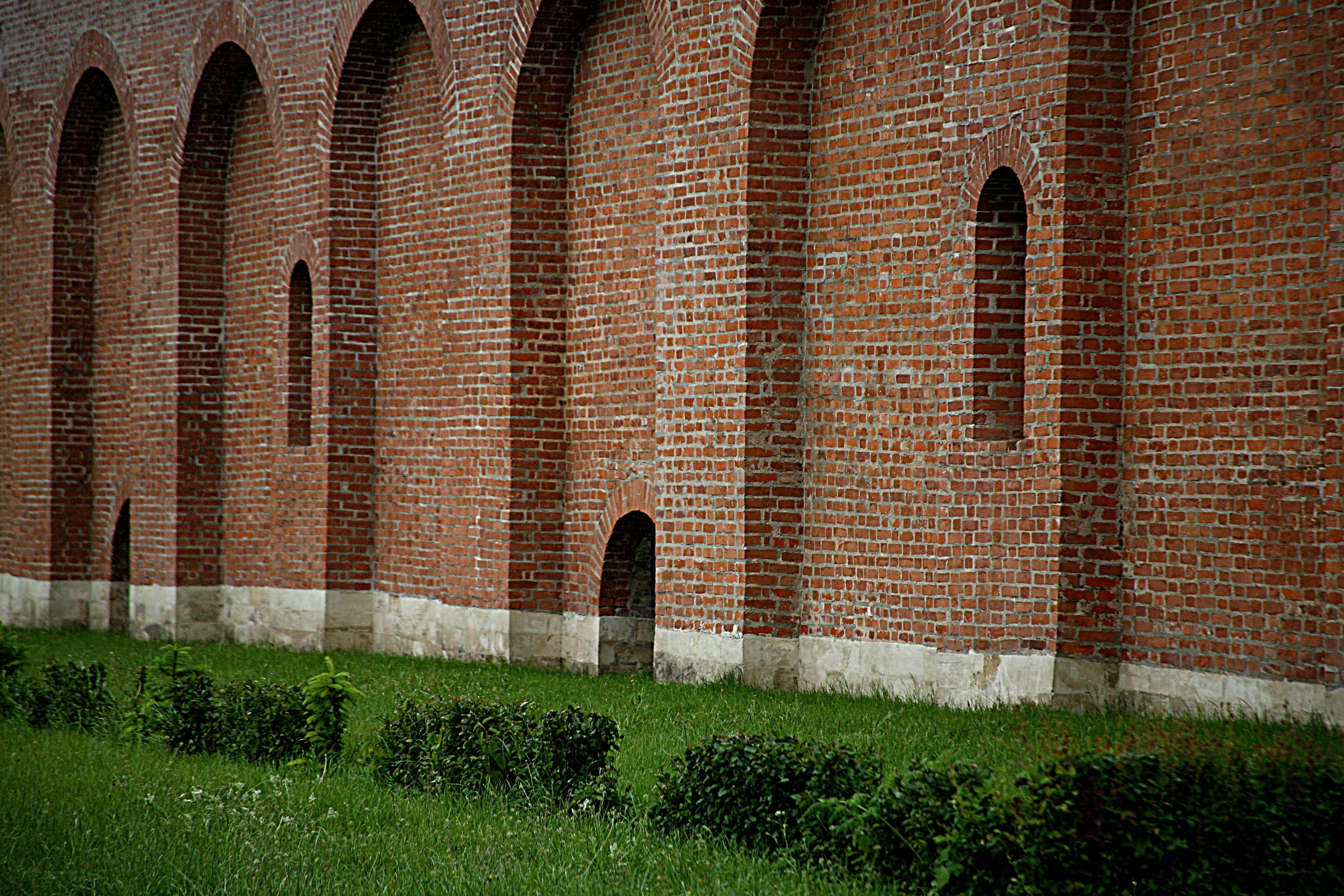 Brick wall with arched openings