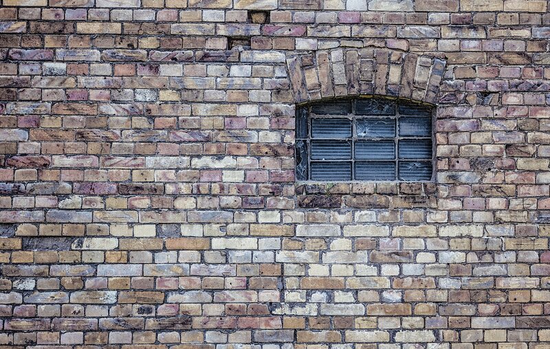 Brick wall with barred window