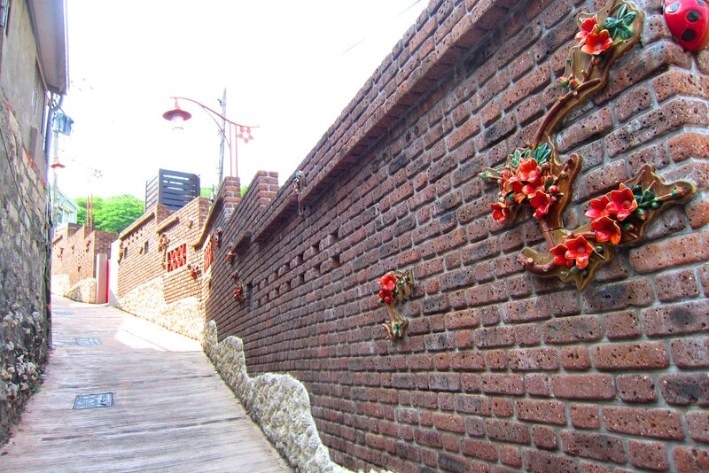 Brick Wall with Ceramic Flowers