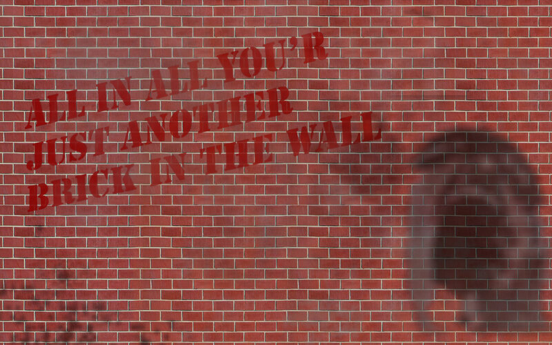 brick wall with graffiti text