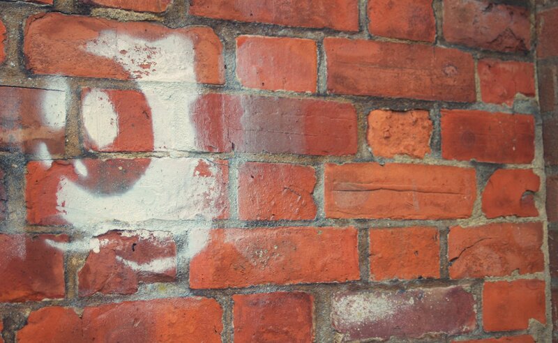 Brick wall with graffiti