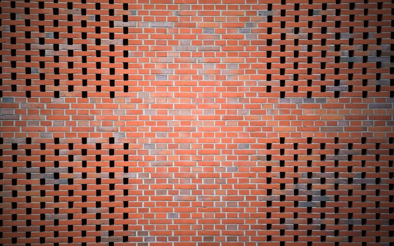 Brick wall with perforated pattern