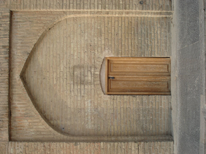 Brick wall with wooden door