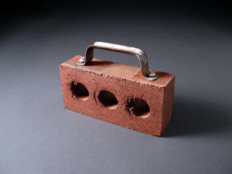 Brick with metal handle