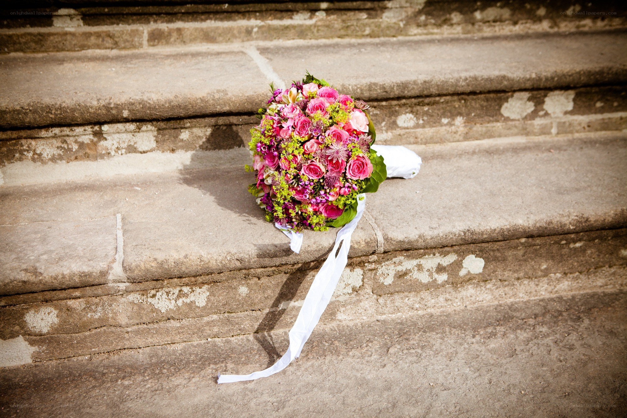 Bridal bouquet on stone steps