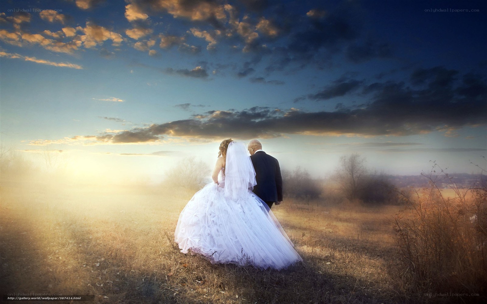 Bride and groom at sunset