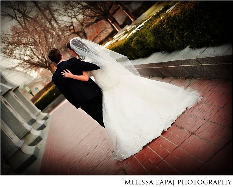 Bride and groom embrace