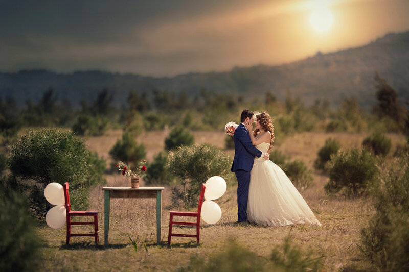 Bride and Groom Embracing — White, Romantic, Sunset, Photograph, Table