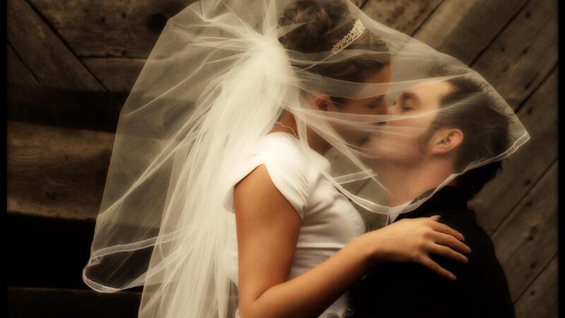 Bride and groom kissing