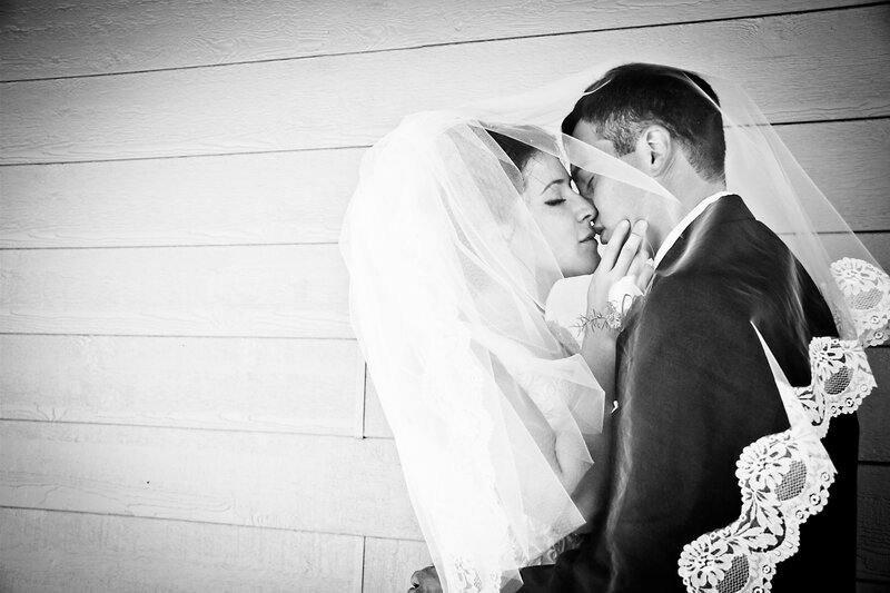 Bride and Groom Kissing — Black, Intimate