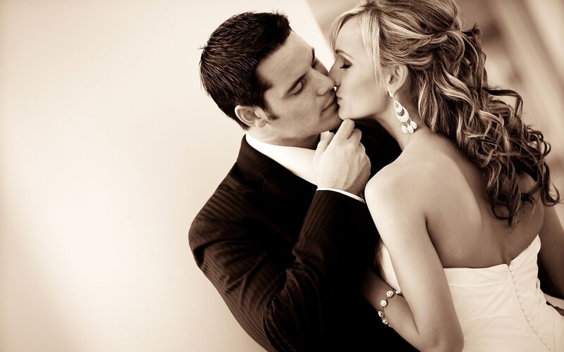 Bride and Groom Kissing — Sepia