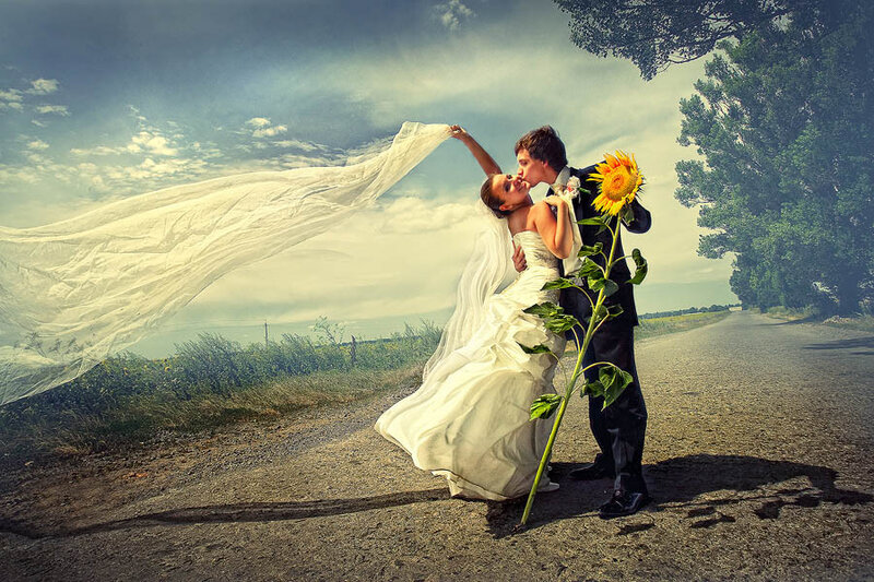 Bride and Groom Kissing — White, Dramatic, Afternoon