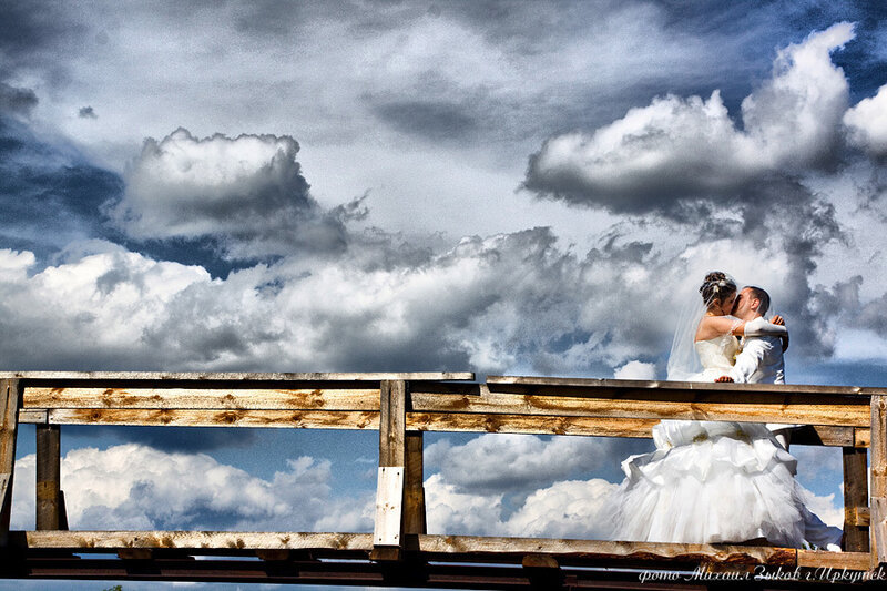 Bride and Groom Kissing — White, Dramatic