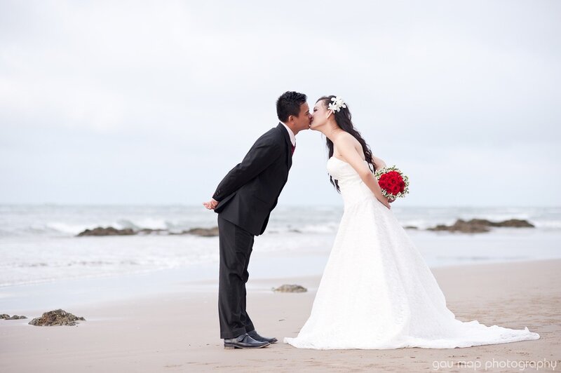 Bride and Groom Kissing — White, Romantic, Afternoon, Photograph, Beach, Ocean