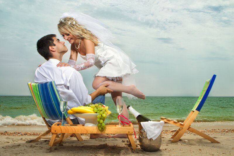 Bride and groom on beach