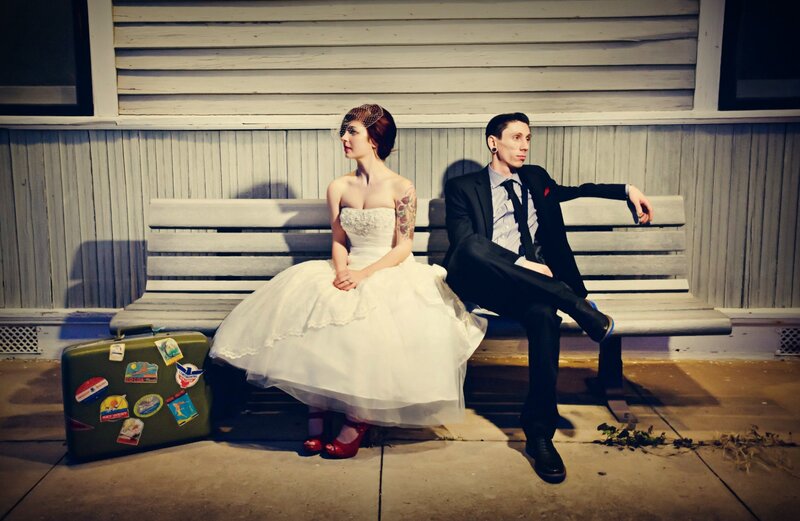 Bride and Groom on Bench — White, Dramatic