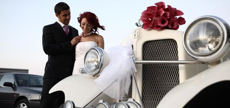 Bride and Groom with Car