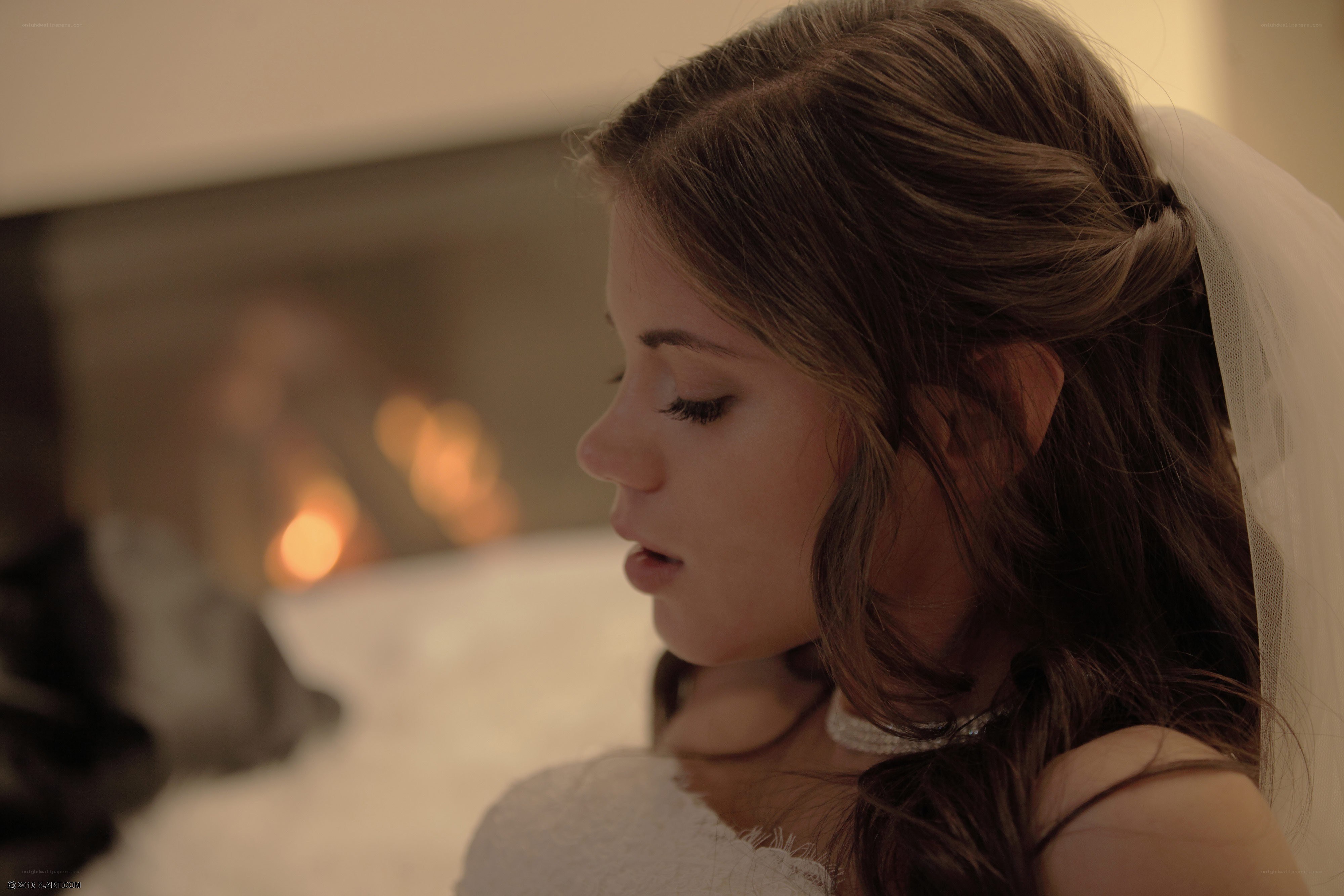 Bride by the fireplace