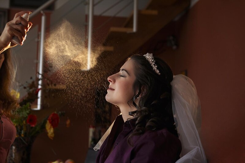 Bride Getting Sprayed