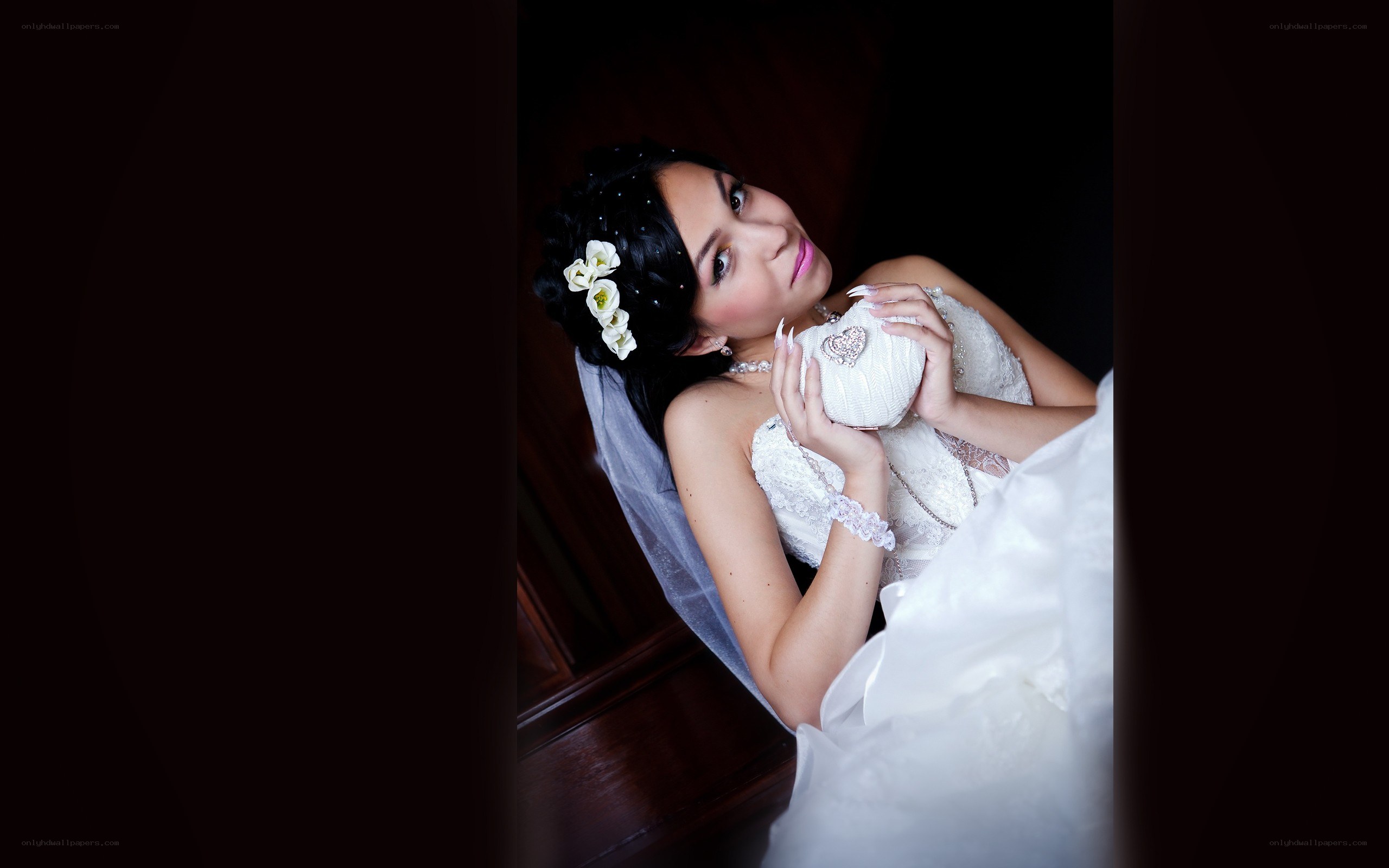 Bride holding a heart-shaped purse