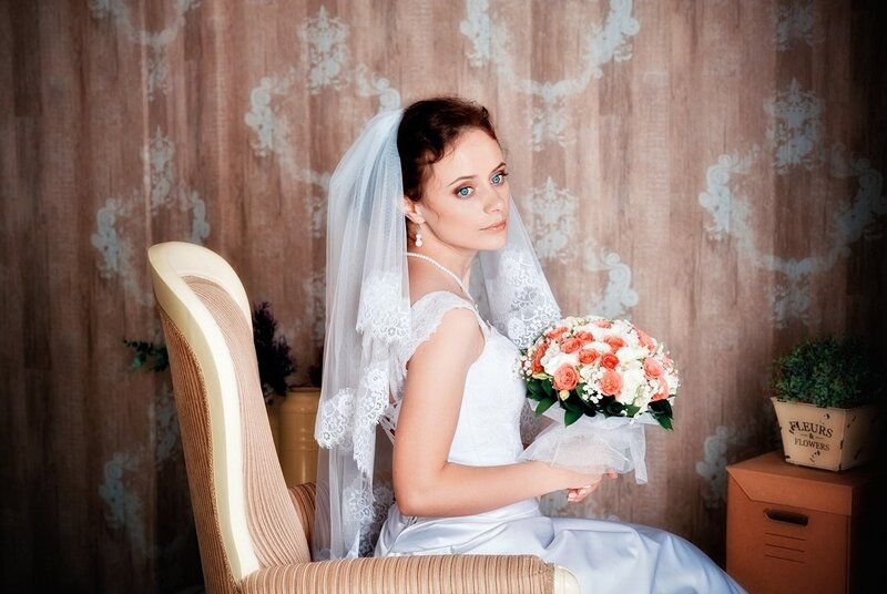 Bride Holding Bouquet — White, Serene, Photograph, Veil, Chair