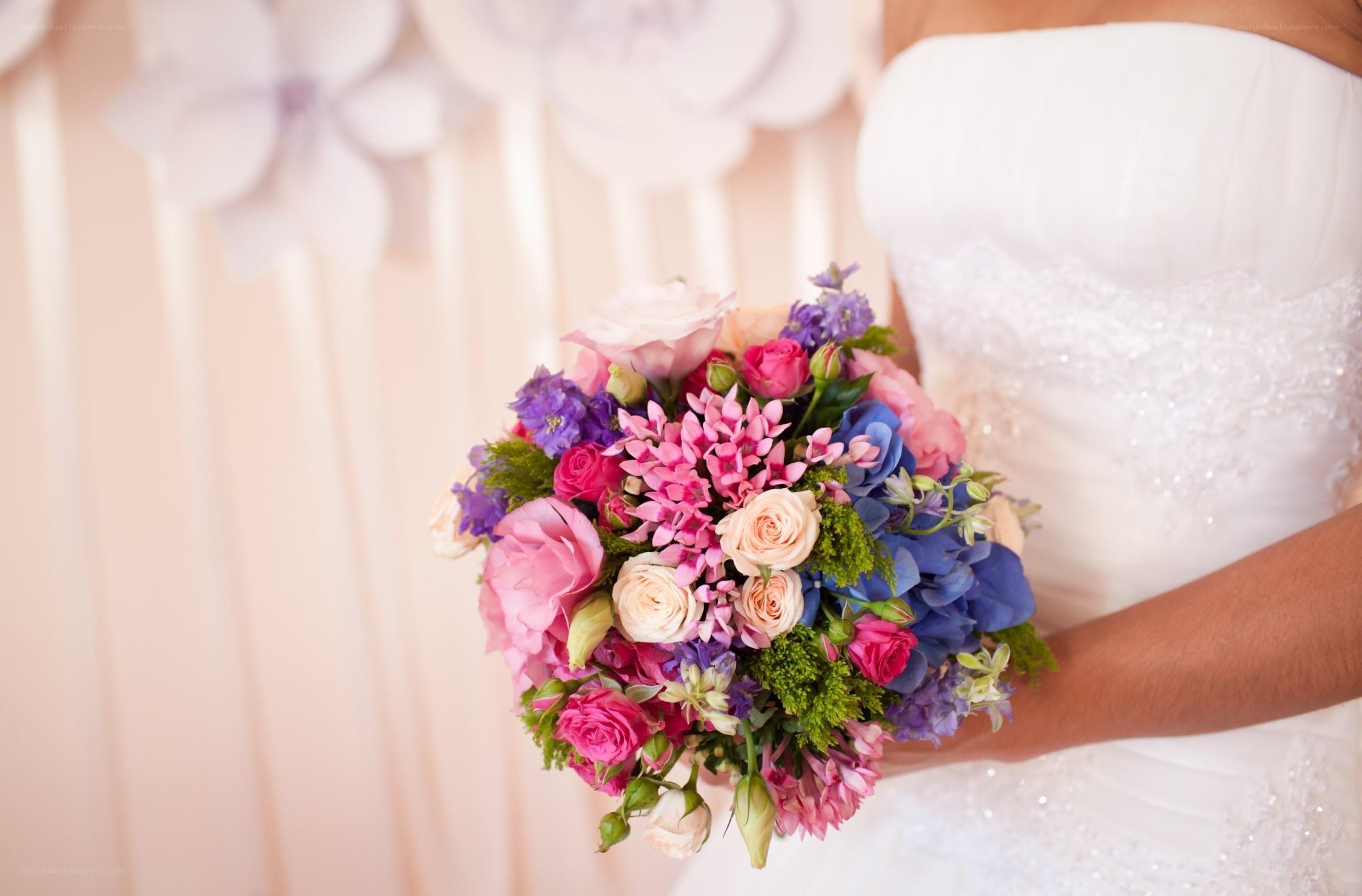 Bride holding colorful bouquet
