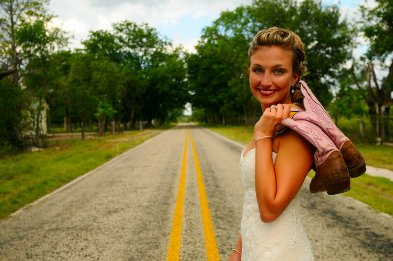 Bride Holding Cowboy Boots