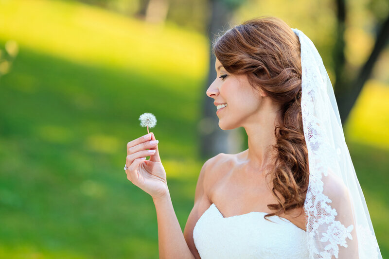 Bride Holding Dandelion
