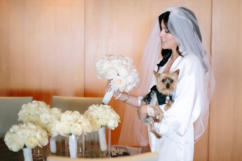 Bride Holding Dog