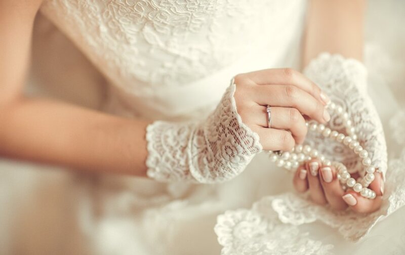 Bride Holding Pearls