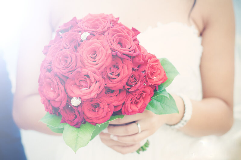 Bride Holding Red Roses