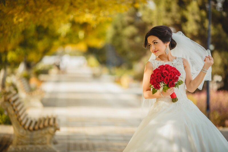 Bride Holding Red Roses — White