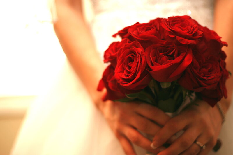 Bride Holding Roses — Red