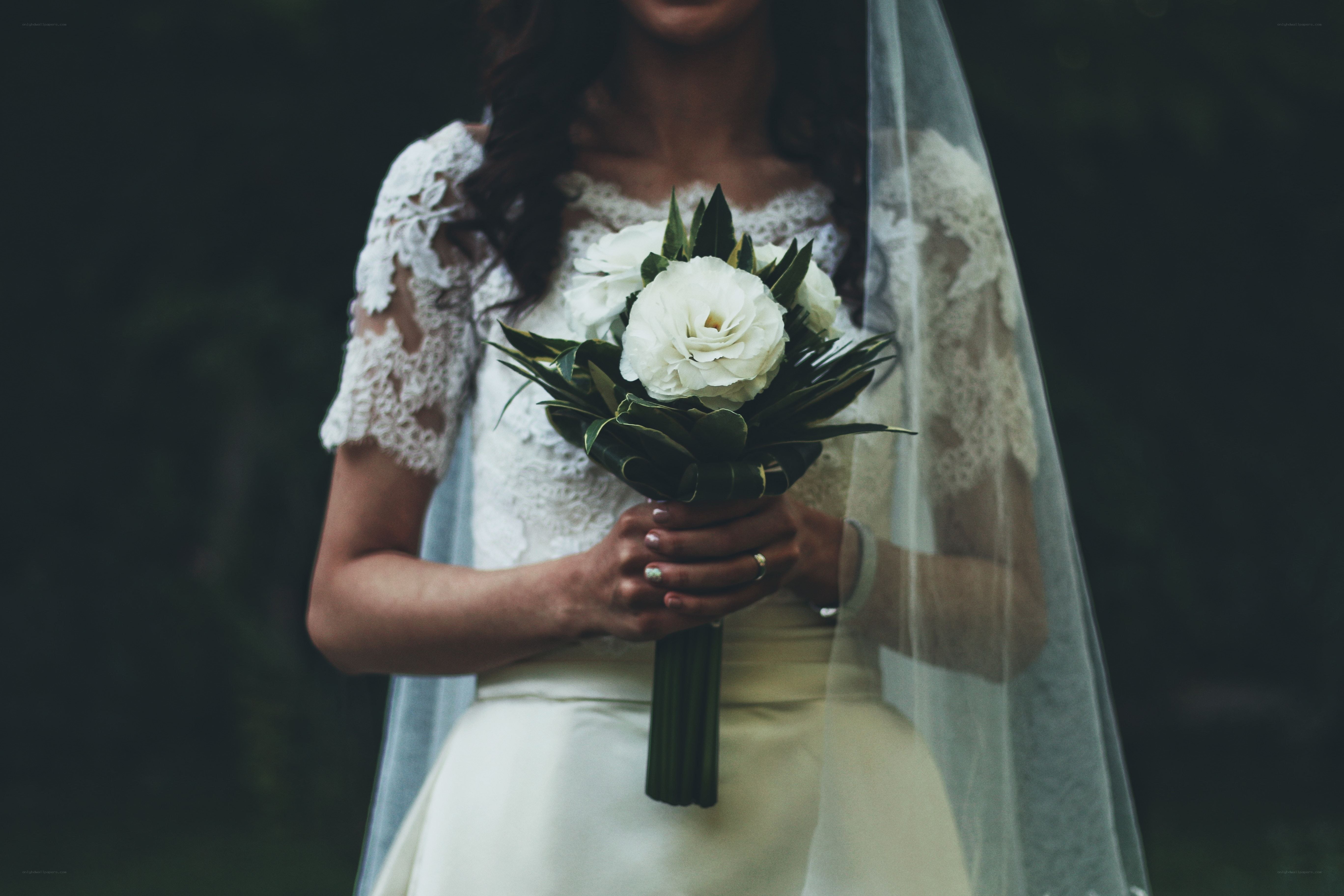 Bride holding white bouquet