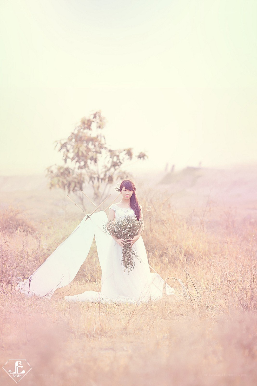 Bride in a field with flowers