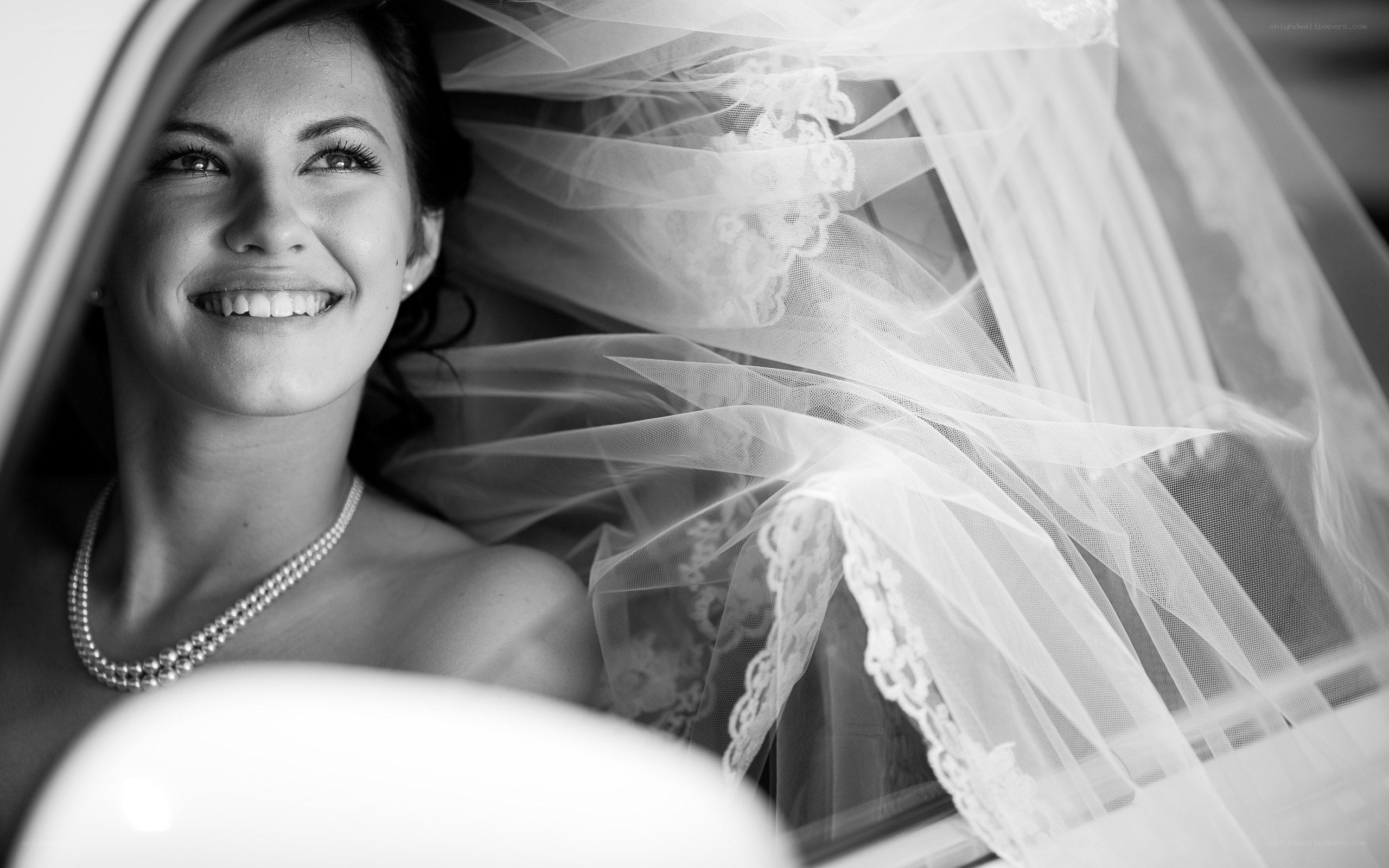 Bride in car with veil