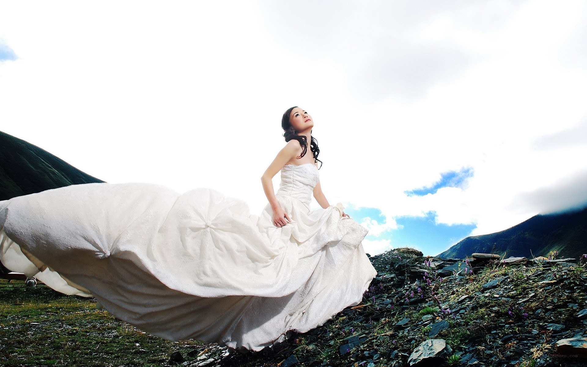Bride in mountain landscape