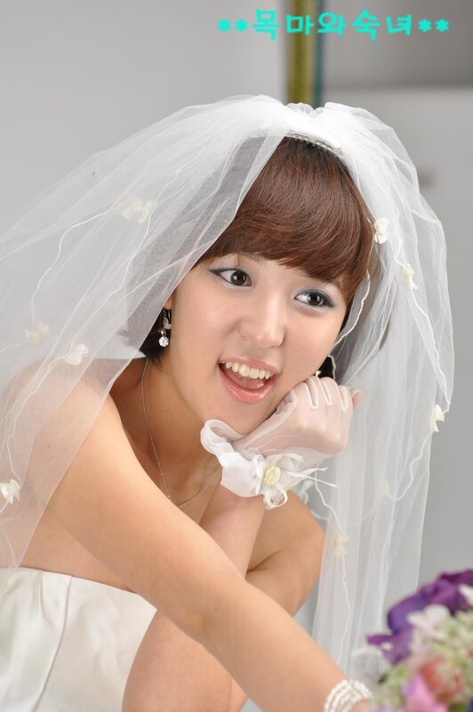 bride in veil smiling