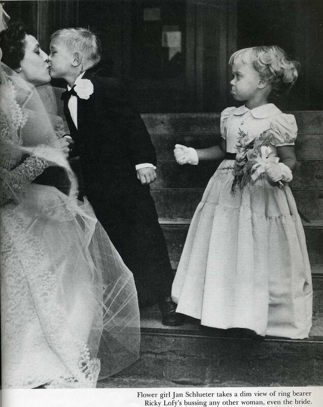 Bride kissed by ring bearer