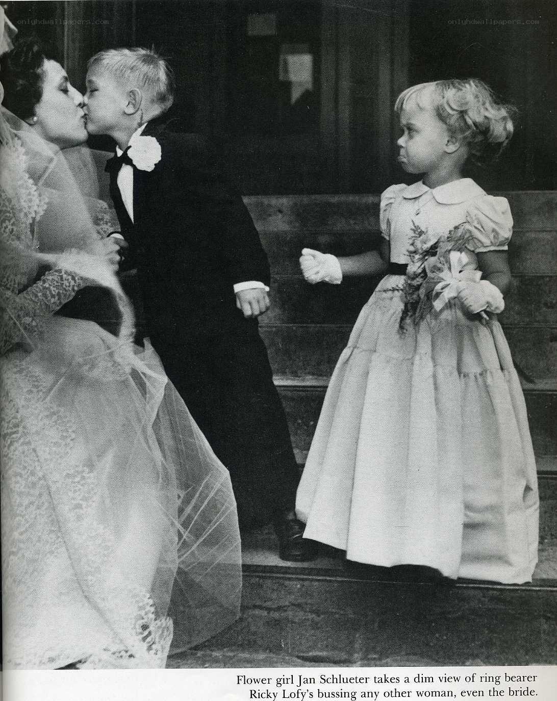 Bride kissed by ring bearer