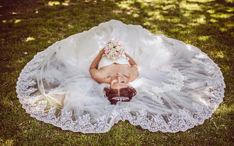Bride Lying on Grass