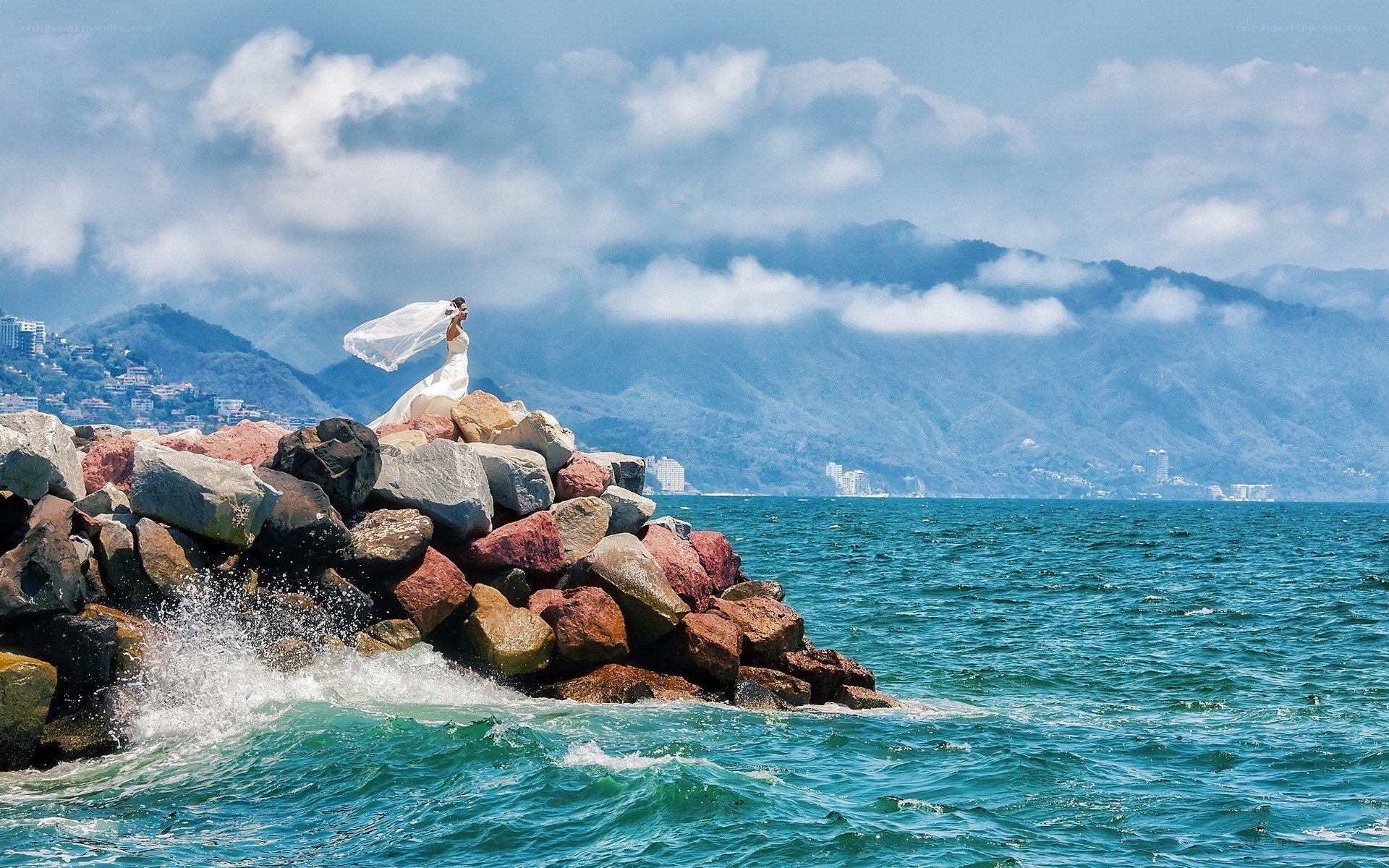 Bride on a rocky pier