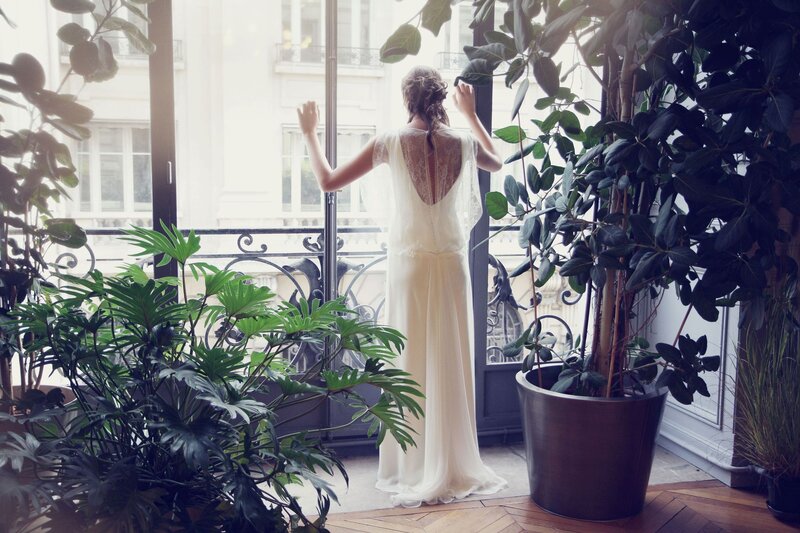 Bride on a sunlit balcony