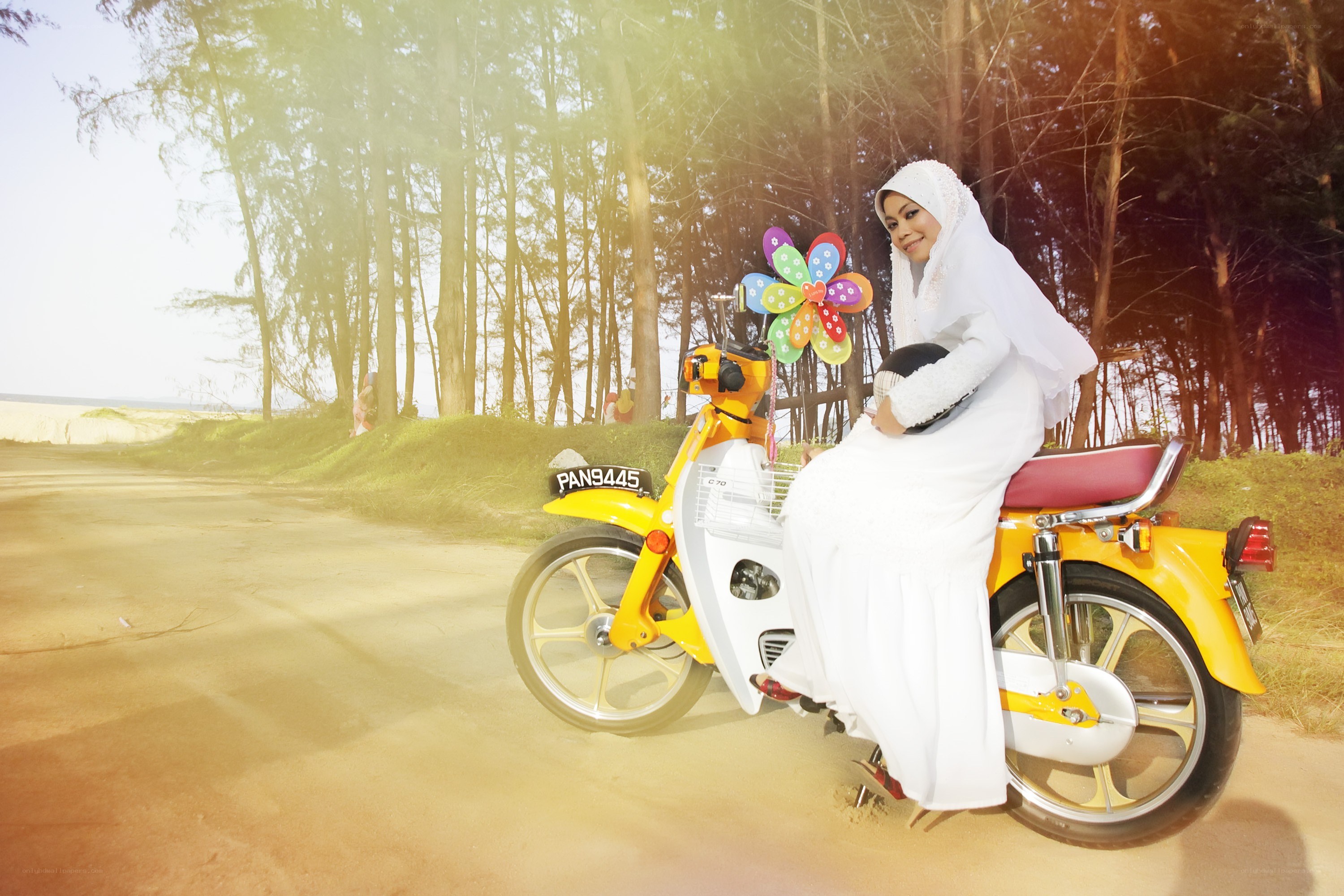 Bride on a yellow scooter