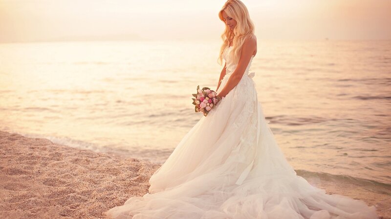 Bride on the beach at sunset