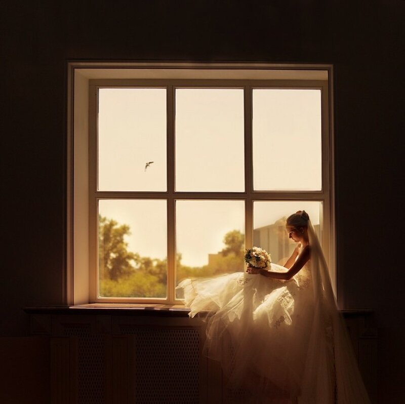 Bride Sitting by Window